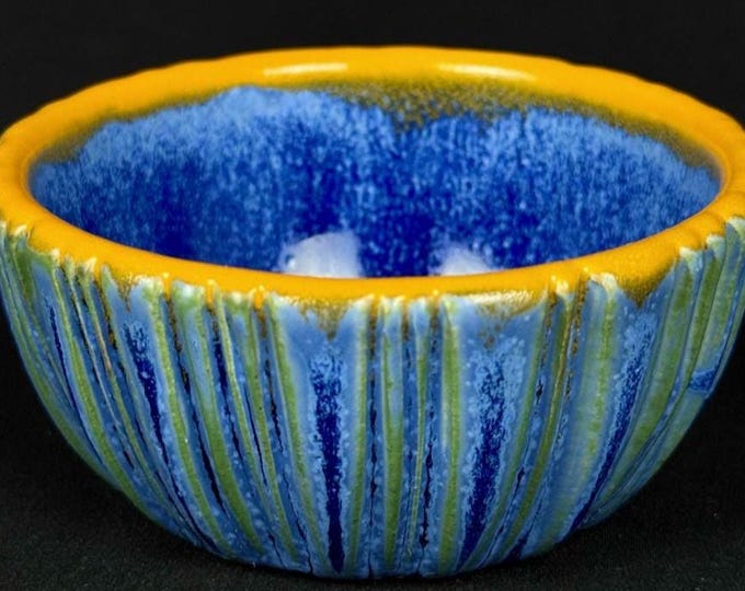 small handmade porcelain bowl in blue and orange