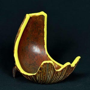handmade porcelain spoon and ladle rest in red, gray, and yellow