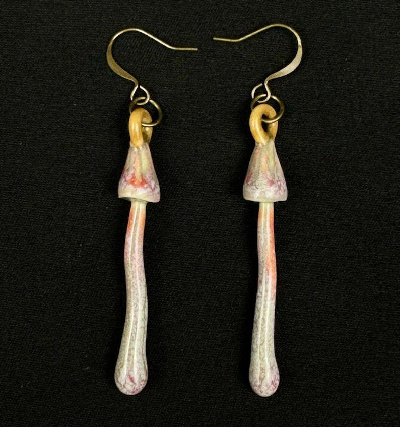 handmade porcelain psilocybin earrings glazed in sage gray purple and pink glazes, antique bronze plated brass findings