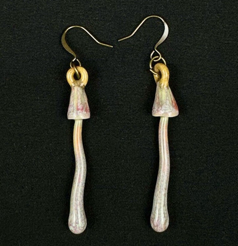 handmade porcelain psilocybin earrings glazed in sage gray purple and pink glazes, antique bronze plated brass findings