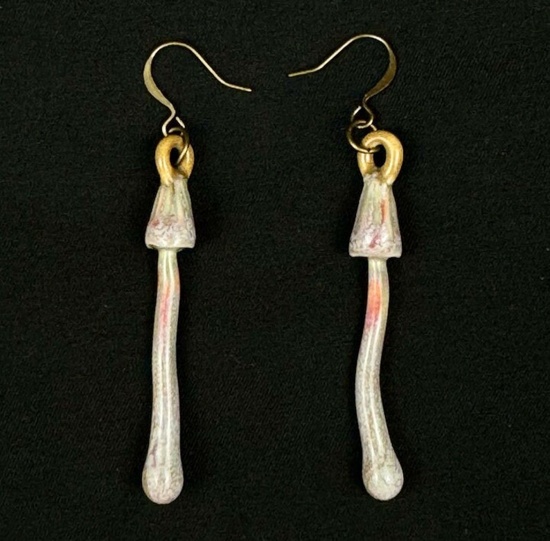 handmade porcelain psilocybin earrings glazed in sage gray purple and pink glazes, antique bronze plated brass findings