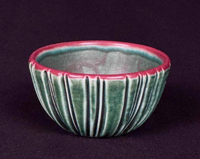 small handmade porcelain bowl in turquoise and red