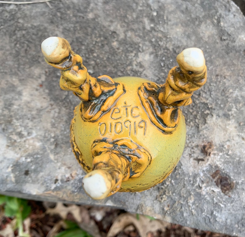 melon green and black small ceramic bud vase in golden yellow