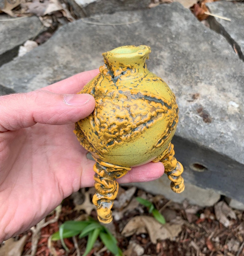 melon green and black small ceramic bud vase in golden yellow