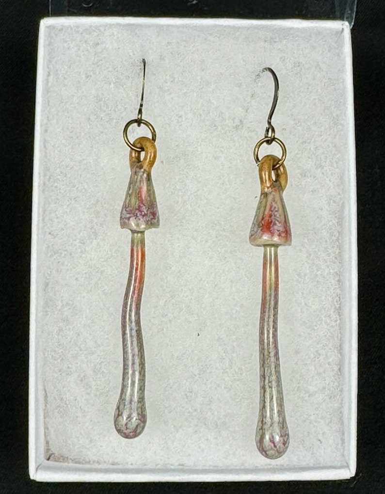 handmade porcelain psilocybin earrings glazed in sage gray purple and pink glazes, antique bronze plated brass findings