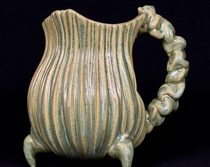 handmade whimsical porcelain mug in green and orange