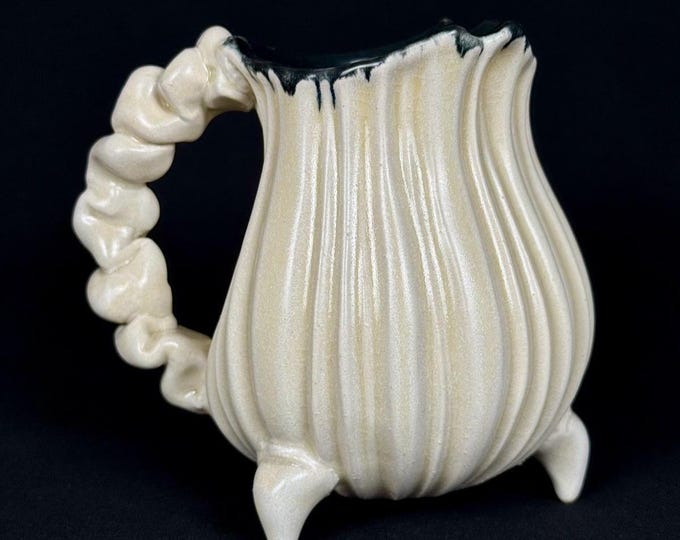 handmade whimsical porcelain tripod mug in white and black