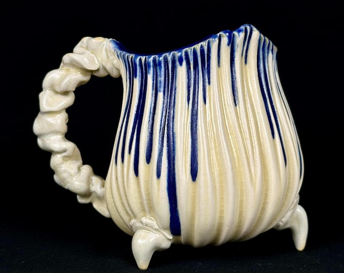 handmade whimsical porcelain mug in white and blue