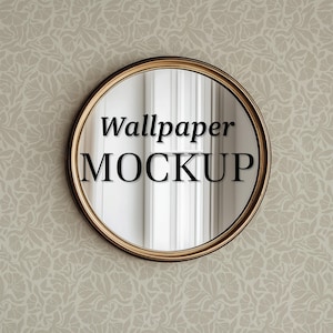 May include: A round mirror with a gold frame, reflecting a white wall with the text "Wallpaper MOCKUP" in black.