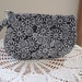 JUDEE PEZZOTTI reviewed Floral Daisy Smart phone Pouch Daisy Clutch Floral Wristlet Zipper Gadget Pouch in Dark Gray