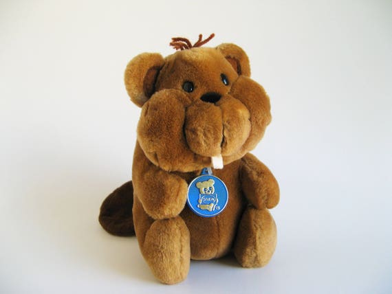 brown stuffed animal with teeth