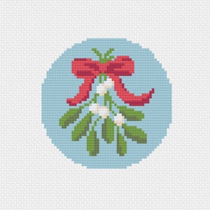 May include: A cross-stitch design of mistletoe with green leaves, white berries, and a red bow, set against a light blue circular background. The design is created with a pixelated effect, giving it a handcrafted appearance.