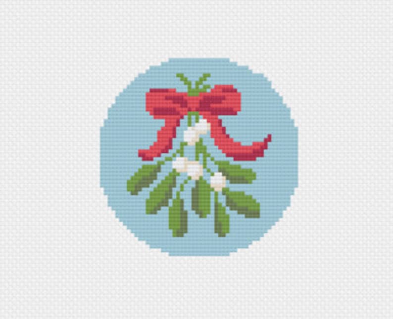 May include: A cross-stitch design of mistletoe with green leaves, white berries, and a red bow, set against a light blue circular background. The design is created with a pixelated effect, giving it a handcrafted appearance.
