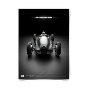 May include: A silver 1938 Auto Union Type D race car poster. The vintage vehicle is centered, showcasing its streamlined design and large tires. The poster has the text "1938 - AUTO-UNION - TYPE D" at the top, set against a dark background.
