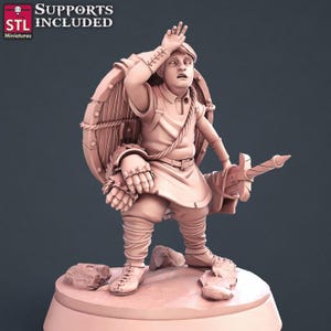 May include: A 3D printed miniature of a fantasy character, a human warrior with a shield and sword, wearing a tunic and leather armour. The miniature is posed in a dynamic action pose, with the warrior's hand raised in a gesture of defence or surprise. The miniature is painted in a light brown colour, with details in darker shades of brown.