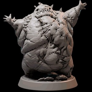 May include: A grey, stitched, and textured figure with a large, round body and outstretched arms. The figure is standing on a round base.