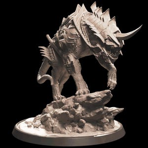 May include: A detailed, grey, sculpted figurine of a mythical beast wearing armour. The beast has a long tail, sharp claws, and a horned helmet. It stands on a rocky base.