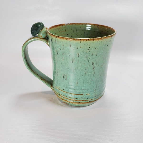 coffee mug with gemstone thumbrest in green stoneware pottery