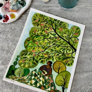 May include: Watercolor painting of a person sitting under a large green tree with a patchwork quilt. The person is wearing a dark top and has dark skin. The tree has green leaves with some red and yellow leaves. The background is a light blue sky.