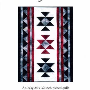 May include: A quilt pattern for a Navajo Star quilt. The pattern is for a 24 x 32 inch quilt. The pattern features a geometric design with red, black, white, and gray colors. The pattern is from Elizabeth Anne Quilt Designs.
