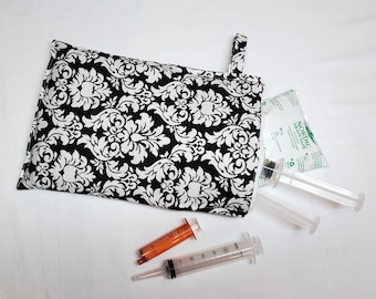 Black and White Syringe Tote lets you carry 5-6 prefilled 60 mL syringes with ice pack, in a compact little folio. Ready to Ship.