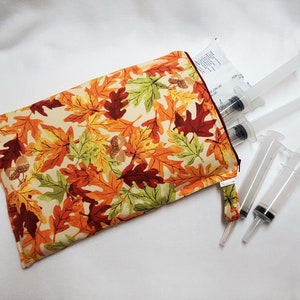 Fall Leaves Syringe Tote lets you carry 5-6 prefilled 60 mL syringes with ice pack, in a compact little folio. Ready to Ship.