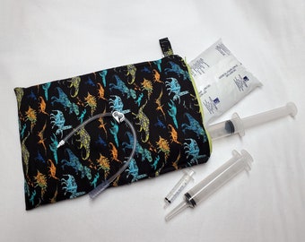 Dinosaurs Syringe Tote lets you carry 5-6 prefilled 60 mL syringes with ice pack, in a compact little folio. Ready to Ship.