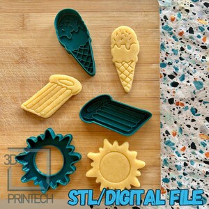May include: A selection of summer-themed cookie cutters, including an ice cream cone, a sun, and a pool float. The cutters are teal and yellow, with the text "STL/DIGITAL FILE" in the bottom right corner.