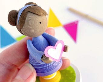 Made to order love figurine in your choice of colors holding a heart, made from paper, quilled paper art doll, a gift to comfort