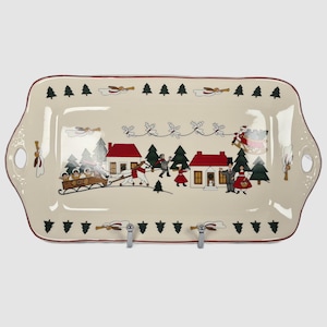 May include: Rectangular ceramic serving platter with a cream-colored background and a festive Christmas village scene. The platter features a red border and handles, with illustrations of houses, trees, and people. Decorative accents include angels and Santa Claus.