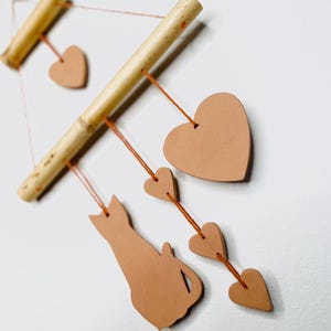 Terracotta wind chimes cats, hearts, monstera, cattleya