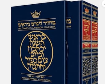 May include: A three-volume set of prayer books in Hebrew, titled "Mahzor L'Yomim Noraim: The Complete Artscroll Machzor" for Rosh Hashanah and Yom Kippur. The books have a dark blue cover with gold lettering and a crown design. The front cover features a circular design with Hebrew text in gold.