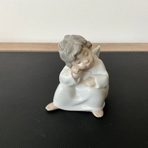 Lladro sitting angel