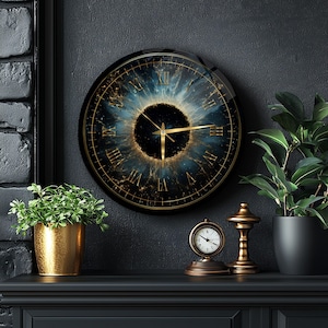 May include: A round wall clock with a black frame and a celestial design. The clock face features a blue and gold galaxy-like pattern with gold Roman numerals and hands. The clock is mounted on a dark wall.