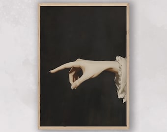 May include: A framed print featuring a hand with a pointed finger against a dark background. The hand is rendered in a classical style, with a detailed depiction of the skin and the delicate folds of the fabric at the wrist.