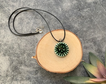 Green circle ceramic pendant, porcelain pendant necklace, waxed black cord, ceramic jewelry, stamped clay, textured