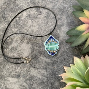 Blue and gold ceramic pendant, porcelain pendant necklace, stamped texture, gold luster, waxed black cord, ceramic jewelry