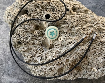 Aqua blue sand dollar circle ceramic pendant, porcelain pendant necklace, waxed black cord, ceramic jewelry, stamped clay, textured