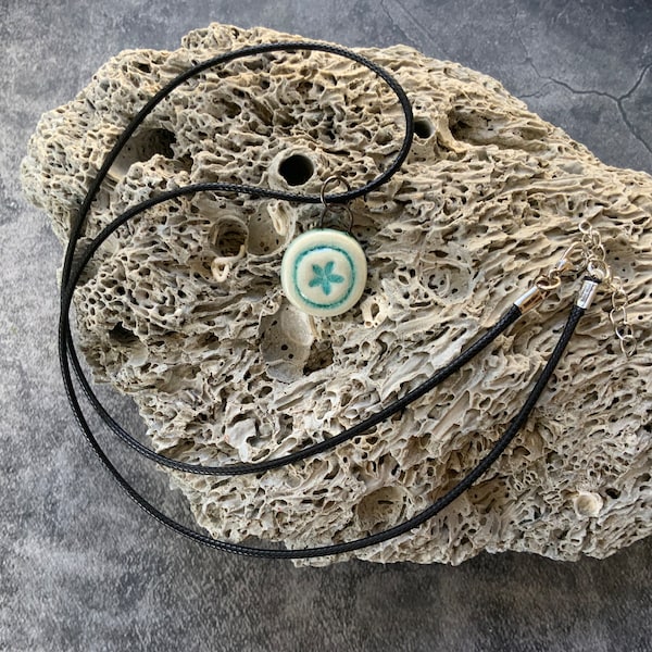 Aqua blue sand dollar circle ceramic pendant, porcelain pendant necklace, waxed black cord, ceramic jewelry, stamped clay, textured