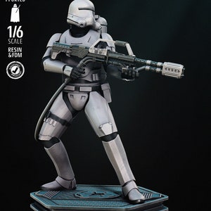 May include: A white 1/6 scale action figure of a Star Wars Stormtrooper with a black helmet and a large blaster rifle. The figure is standing on a gray base with the text "SW3D PATREON" printed on it.