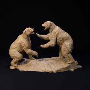 May include: A beige sculpture of two bears in a confrontational pose. One bear stands on its hind legs, arm outstretched, while the other crouches. The sculpture sits on a stone-like base against a black background.