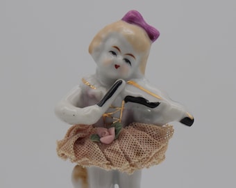 Porcelain Figurine of Young Girl Playing Violin