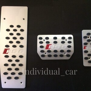 May include: Set of three silver-colored car pedal covers. Each pedal cover has black rubber inserts for grip and the red letters "RS6". The largest pedal cover is rectangular with oval cutouts. The text "Individual_car" is at the bottom.