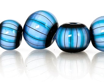 Aqua blue, white, and black stripes on soft denim blue bead set, Contemporary patterns in glass, handmade lampwork beads by JC Herrell