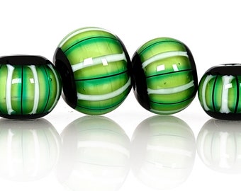 Emerald, white, and black stripes on pale green bead set, Contemporary patterns in glass, handmade lampwork beads by JC Herrell