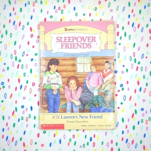 May include: A vintage paperback book titled "Sleepover Friends" by Susan Saunders. The cover features illustrations of children and the text "#24 Lauren's New Friend." The book has a pink and yellow border with the words "Apple Paperbacks" at the top.