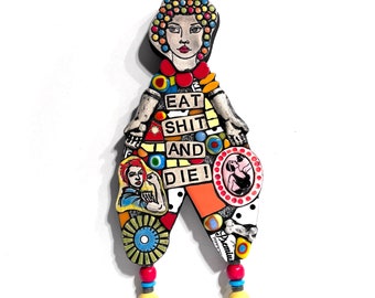 Eat Shit And Die! (An Original Junk Assemblage Mosaic Salvaged Trash Doll Mixed Media Wall Hanging by Artist Shawn DuBois)