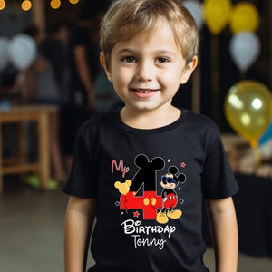 May include: A black t-shirt with a red and black number four, Mickey Mouse wearing sunglasses, and the text "My 4th Birthday Tonny".