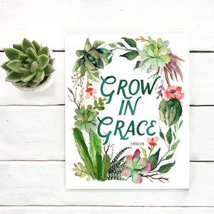 May include: A watercolor print with a green succulent wreath surrounding the text "GROW IN GRACE" with the scripture reference "2 PETER 3:18" below.