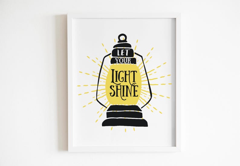 May include: A black and yellow printable wall art design featuring a lantern with the text "Let your light shine".